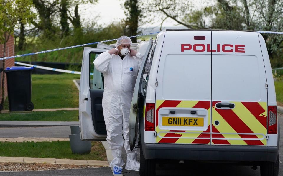 Forensic officers at an address in Aylesham, Kent, on Saturday - Steve Parsons/PA