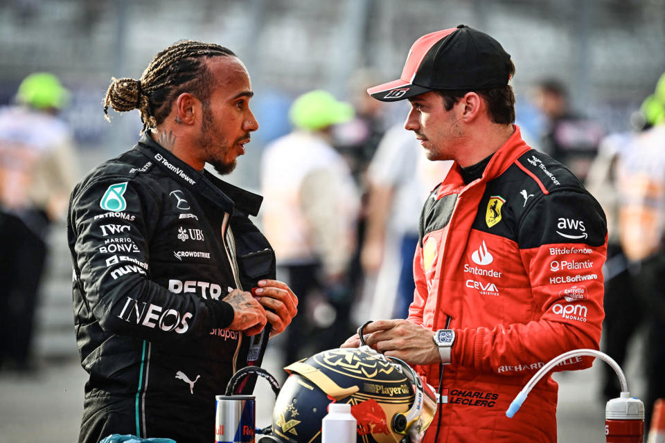 Image: Mercedes' Lewis Hamilton speaks with Ferrari's Charles Leclerc  (Chandan Khanna / AFP - Getty Images)