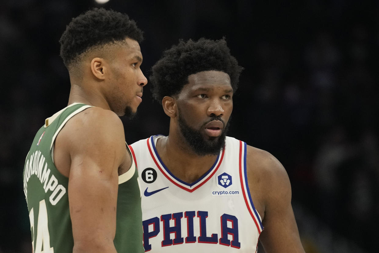 Milwaukee's Giannis Antetokounmpo and Philadelphia's Joel Embiid look on during their game on March 4, 2023, at Fiserv Forum in Milwaukee. (Patrick McDermott/Getty Images)