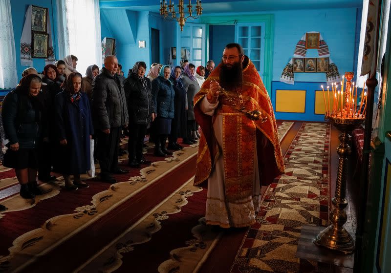 A priest father Dymytriy attends a service in the church, which switched from the Ukrainian Orthodox Church to the Orthodox Church of Ukraine in the village of Hrabivtsi