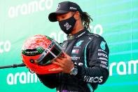 <p>On Dec. 1, Hamilton's Mercedes team<a href="https://edition.cnn.com/2020/12/01/motorsport/lewis-hamilton-coronavirus-uk-gbr-spt-intl/index.html" rel="nofollow noopener" target="_blank" data-ylk="slk:confirmed to CNN;elm:context_link;itc:0;sec:content-canvas" class="link "> confirmed to CNN</a> that the 35-year-old British Formula 1 driver was self-isolating after testing positive, <a href="https://people.com/sports/lewis-hamilton-to-miss-2020-sakhir-grand-prix-after-testing-positive-for-covid/" rel="nofollow noopener" target="_blank" data-ylk="slk:and is only experiencing mild symptoms;elm:context_link;itc:0;sec:content-canvas" class="link ">and is only experiencing mild symptoms</a>.</p> <p>"He is otherwise fit and well, and the entire team sends him its very best wishes for a swift recovery," the team said in a statement.</p> <p>According to Mercedes, Hamilton woke up on Nov. 30 with mild symptoms and later found out he had been exposed to the virus prior to the Bahrain Grand Prix the day before. He had tested negative three times the previous week ahead of the race.</p> <p>In his own social media post, Hamilton wrote that he was "gutted to not be able to race this weekend but my priority is to follow the protocols and advice to protect others."</p> <p>He continued, "I'm really lucky that I feel ok with only mild symptoms and will do my best to stay fit and healthy."</p>