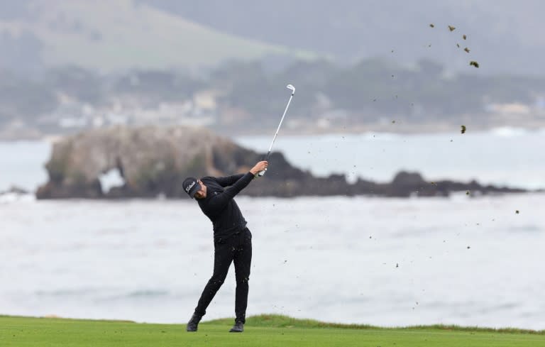 PGA Pebble Beach Pro-Am leader Wyndham Clark must wait until Monday to try and win the event after officials postponed the final round due to a severe storm and safety concerns (EZRA SHAW)