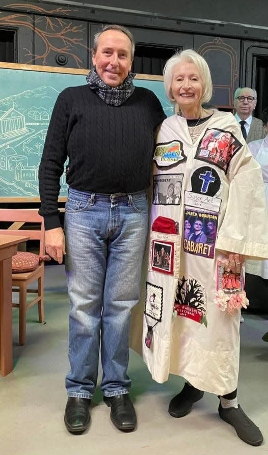 From left are friend Jeff Belanger and Kathy Castro, wearing the "gypsy" robe backstage at Little Theatre of Fall River. The robe is given at Little Theatre to the person who has put in the most work for each particular performance.