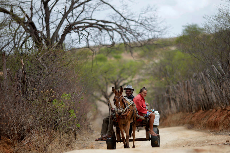 <p>Francisco Barbosa Cruz, 82, and wife Maria de Lourdes, 65, ride in a horse carriage in Pombal, Paraiba state, Brazil, Feb. 11, 2017. (Photo: Ueslei Marcelino/Reuters) </p>