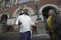 Tun Khin, President of the Burmese Rohingya Organisation UK, reacts outside the International Court in The Hague, Netherlands, Thursday, Jan. 23, 2020, after the court ordered Myanmar take all measures in its power to prevent genocide against the Rohingya. The United Nations' top cour issued a decision on a request by Gambia. (AP Photo/Peter Dejong)