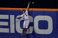 New York Mets center fielder Jake Marisnick cannot catch a two-run home run by Atlanta Braves' Ozzie Albies during the fourth inning of a baseball game on Friday, Sept. 18, 2020, in New York. (AP Photo/Adam Hunger)