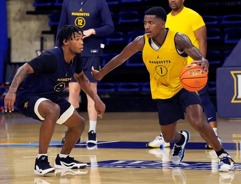 Kam Jones, right, was Marquette's leading scorer last season as a sophomore at 15.1 points per game.