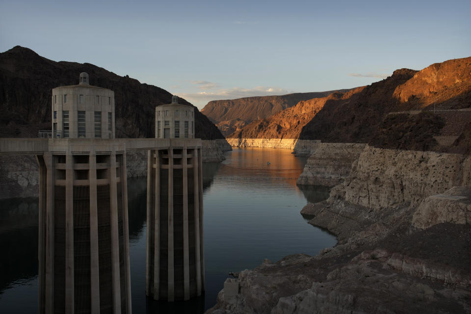 A bathtub ring of light minerals shows the high water line of Lake Mead near water intakes on the Arizona side of Hoover Dam at the Lake Mead National Recreation Area Sunday, June 26, 2022, near Boulder City, Nev. The reservoir is now below 30 percent of capacity, Its level has dropped 170 feet (52 meters) since reaching a high-water mark in 1983. (AP Photo/John Locher)