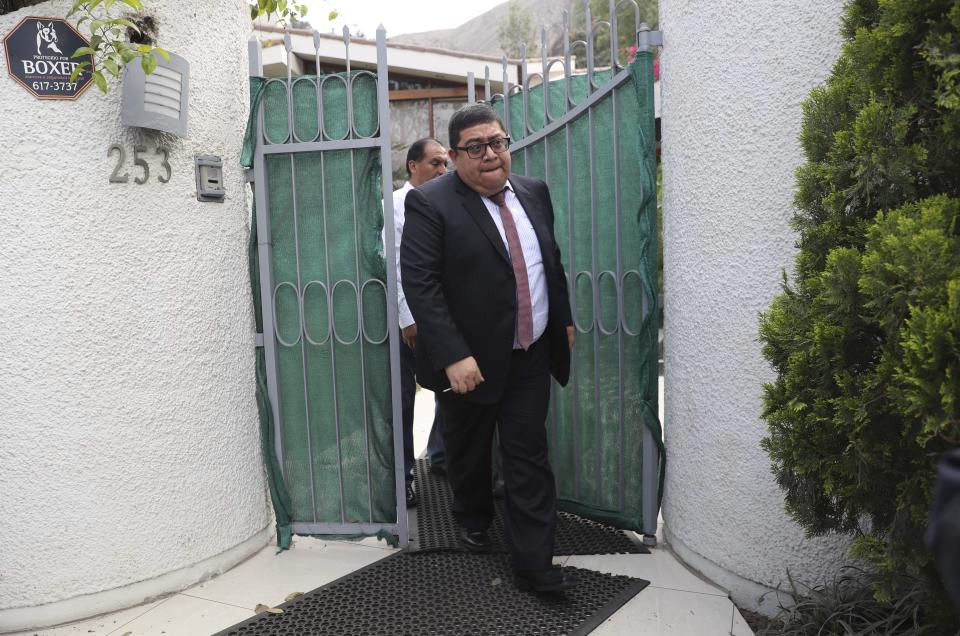 Lawyer of Peru’s former President Alberto Fujimori, Miguel Perez, leaves Fujimori's home in Lima, Peru, Wednesday, Oct. 3, 2018. Peru's Supreme Court has overturned a medical pardon for former President Alberto Fujimori and ordered the strongman be returned to jail to serve out a long sentence for human rights abuses. (AP Photo/Martin Mejia)