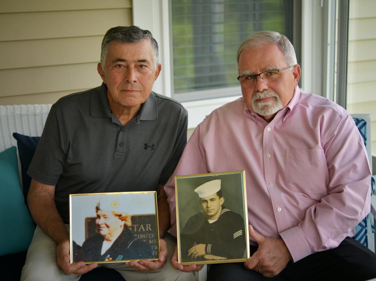 Harry, left, and George Kustigian hold photos of their mother, Valerie Kustigian, a North Oxford Gold Star mother who died May 4 at 94, and their brother Michael, who died in Vietnam.