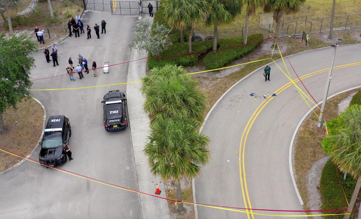 Police investigate the scene in the parking lot of Suncoast Community High School on April 22, 2024 in Riviera Beach, Florida.