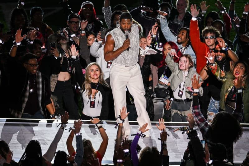 American singer Usher (C) performs during the Apple Music Halftime Show at Super Bowl LVIII, Allegiant Stadium, Las Vegas, Nevada. -/PA Wire/dpa