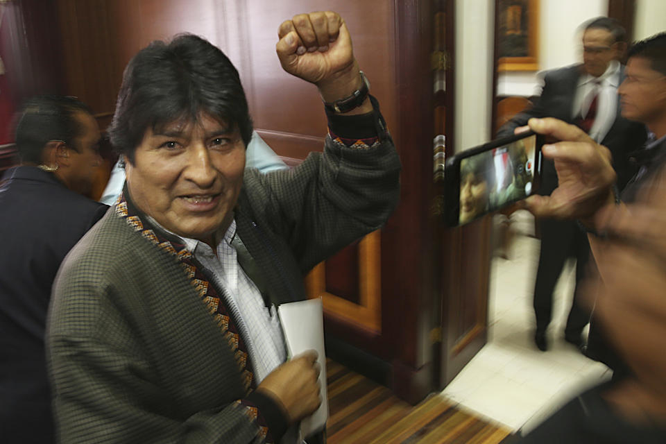 Bolivia's former President Evo Morales pumps his fist after a press conference at the journalists club in Mexico City, Wednesday, Nov. 27, 2019. Morales went into exile in Mexico after he was prodded by police and the military, forcing him to resigned on Nov. 10, after he claimed victory in an election that international observers invited in by the government said was marred by numerous irregularities. (AP Photo/Marco Ugarte)