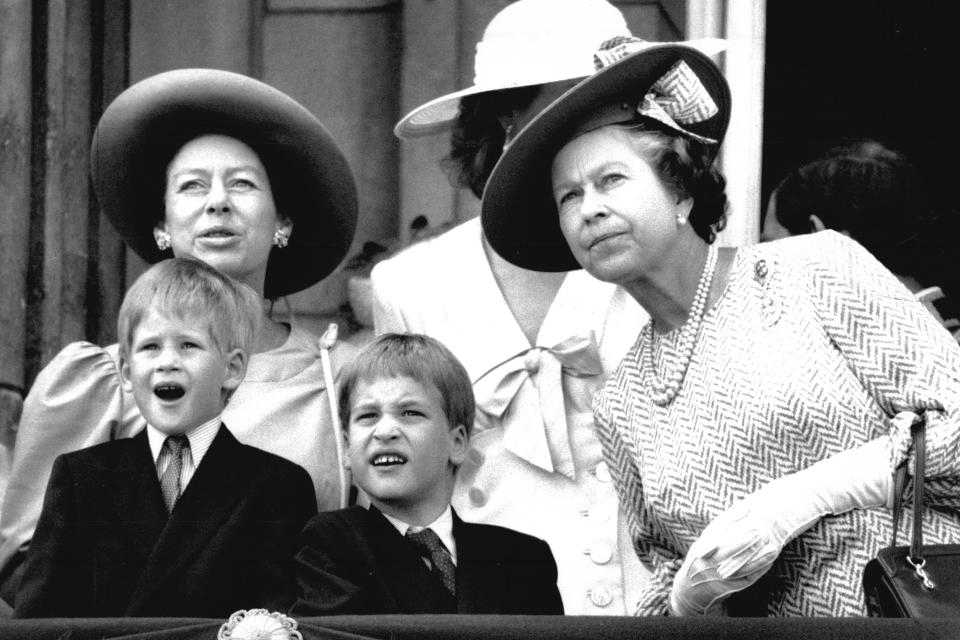 Watching the Trooping the Colour on the balcony with the Queen, brother Prince William and Princess Margaret in 1989.