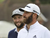 United States' Dustin Johnson, right walks with Spain's Jon Rahm on the 1st fairway during a practice round for the British Open Golf Championship at Royal St George's golf course Sandwich, England, Wednesday, July 14, 2021. The Open starts Thursday, July, 15. (AP Photo/Ian Walton)