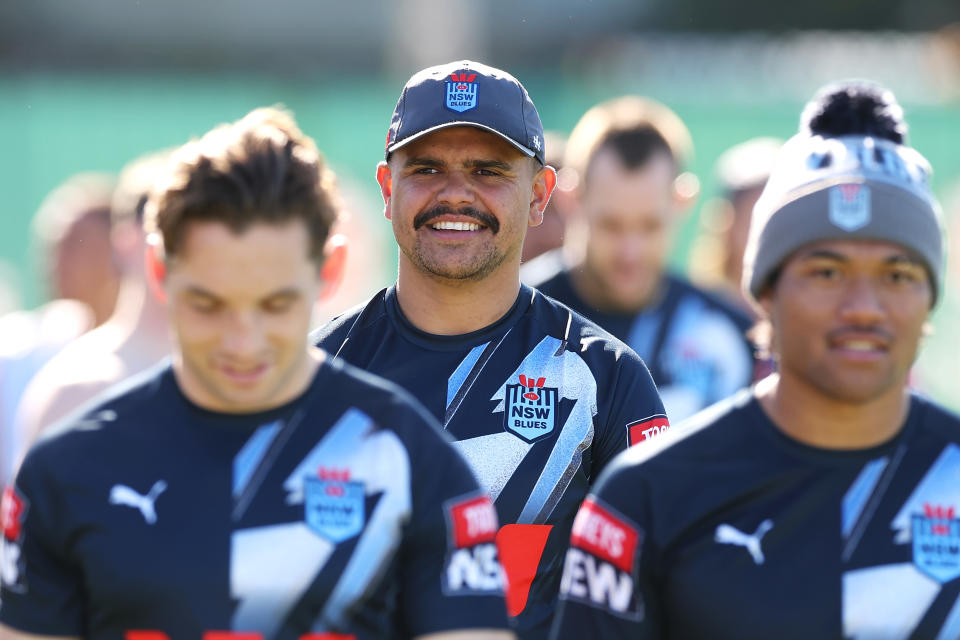 Latrell Mitchell smiles during training.