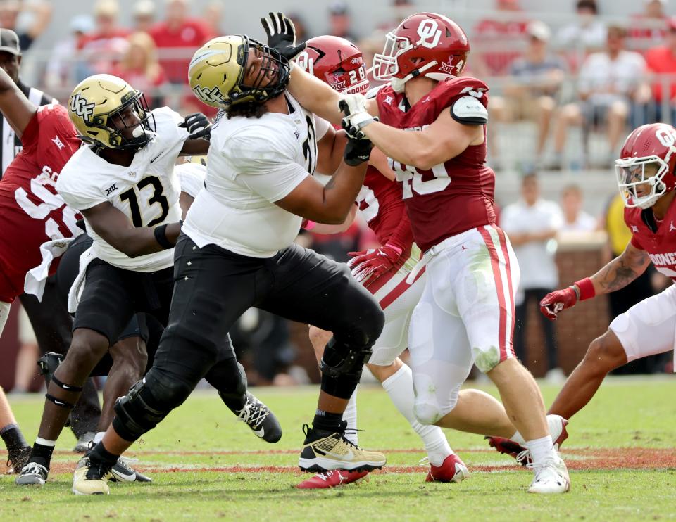 Oklahoma's Ethan Downs (40) blocks against Marcellus Marshall (72) in the first half of the college football game between the University of Oklahoma Sooners and the University of Central Florida Knights at Gaylord Family Oklahoma-Memorial Stadium in Norman, Okla., Saturday, Oct., 21, 2023.