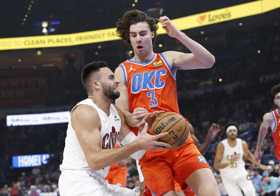 Nov 8, 2023; Oklahoma City, Oklahoma, USA; Oklahoma City Thunder guard Josh Giddey (3) defends a drive by Cleveland Cavaliers guard Max Strus (1) during the first quarter at Paycom Center. Mandatory Credit: Alonzo Adams-USA TODAY Sports