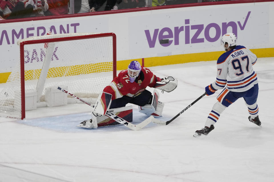 Edmonton Oilers center Connor McDavid (97) scores a goal against Florida Panthers goaltender Sergei Bobrovsky (72) during the second period of an NHL hockey game, Monday, Nov. 20, 2023, in Sunrise, Fla. (AP Photo/Marta Lavandier)