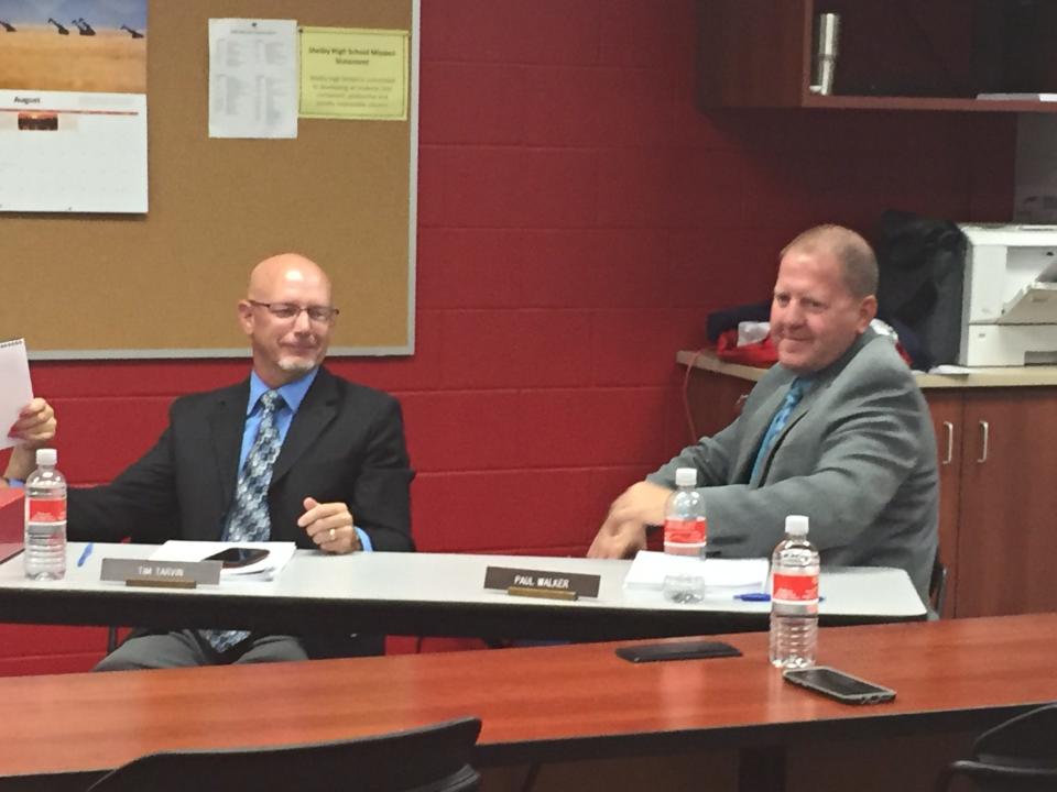 Shelby Superintendent Tim Tarvin, left, and Assistant Superintendent Paul Walker share a laugh during a previous school board meeting.