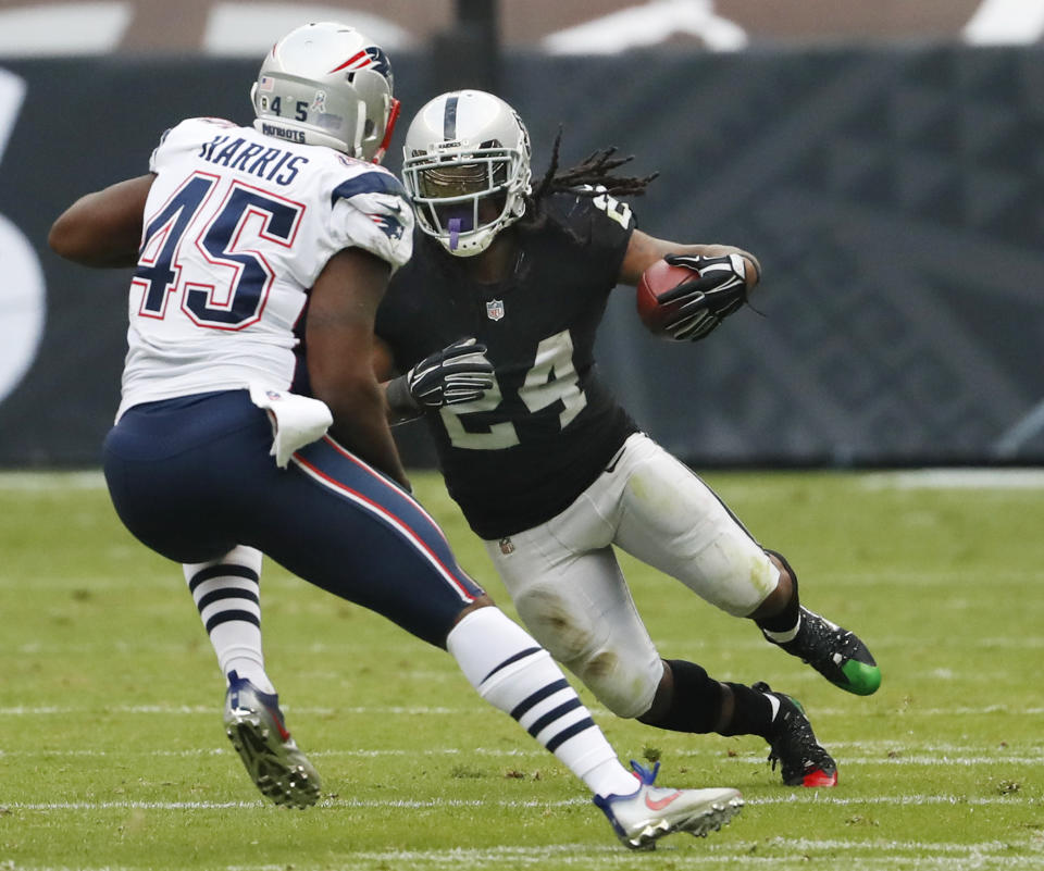 Oakland Raiders running back Marshawn Lynch sat during the national anthem, which drew the attention of Donald Trump. (AP)