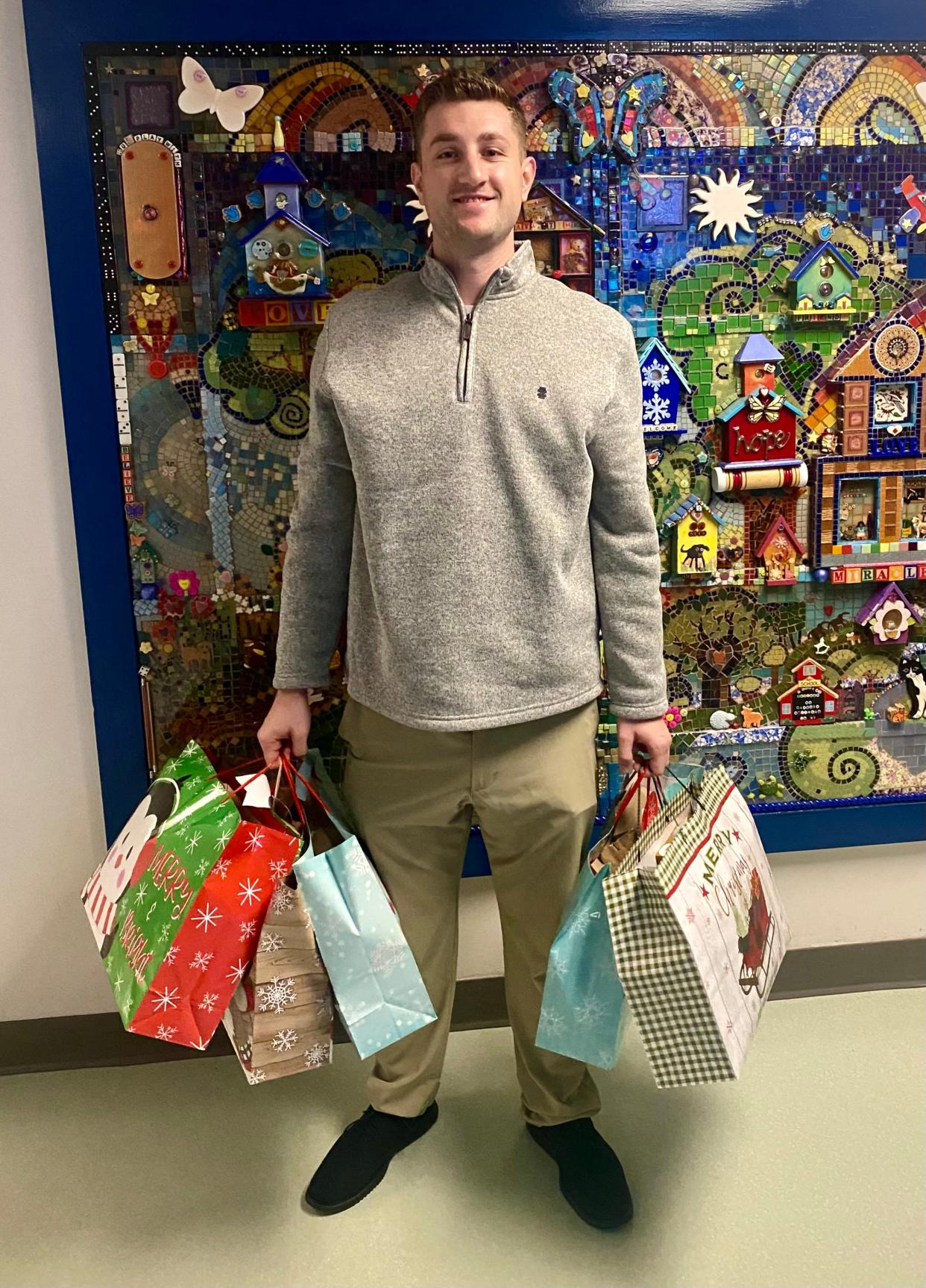 Sven Kleinhans, a University of Florida law student from Germany, makes advent calendars — a Christmas tradition from Germany — for children in hospitals. This year he made some of his calendars, each with 25 small bags, for children in Jacksonville.