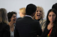 Maisa Rojas, minister of environment of Chile, left, and Germany's climate envoy Jennifer Morgan laugh ahead of a closing plenary session at the COP27 U.N. Climate Summit, Sunday, Nov. 20, 2022, in Sharm el-Sheikh, Egypt. (AP Photo/Peter Dejong)