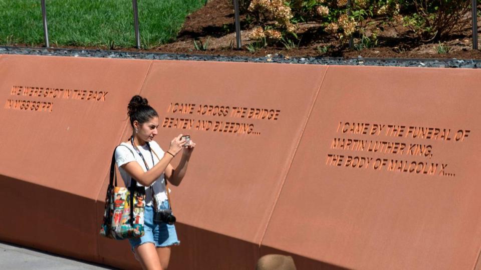 A person walks through North Carolina Freedom Park following a ceremony to mark its opening on Wednesday, Aug. 23, 2023, in Raleigh, N.C. The park honors the African American struggle for freedom.