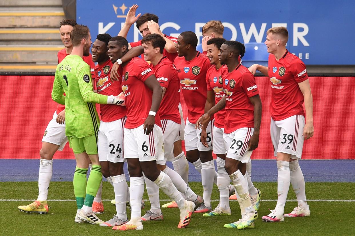 Manchester United's English midfielder Jesse Lingard (3R) celebrates scoring their second goal with team-mates during the English Premier League football match between Leicester City and Manchester United at King Power Stadium in Leicester, central England on July 26, 2020. (Photo by Oli SCARFF / POOL / AFP) / RESTRICTED TO EDITORIAL USE. No use with unauthorized audio, video, data, fixture lists, club/league logos or 'live' services. Online in-match use limited to 120 images. An additional 40 images may be used in extra time. No video emulation. Social media in-match use limited to 120 images. An additional 40 images may be used in extra time. No use in betting publications, games or single club/league/player publications. /  (Photo by OLI SCARFF/POOL/AFP via Getty Images)