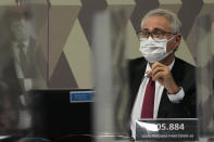 Senator Renan Calheiros speaks during a session by the commission investigating the government's management of the COVID-19 pandemic at the Federal Senate in Brasilia, Brazil, Tuesday, Oct. 26, 2021. (AP Photo/Eraldo Peres)