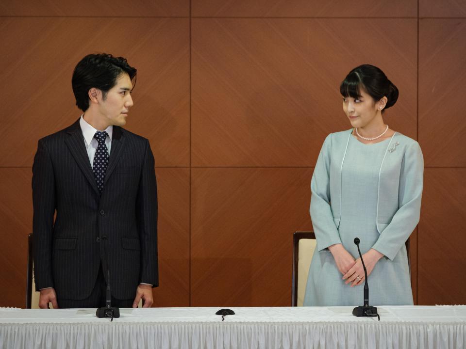 Princess Mako, the elder daughter of Prince Akishino and Princess Kiko, and her husband Kei Komuro, a university friend of Princess Mako, poses during a press conference to announce their wedding at Grand Arc Hotel on October 26, 2021 in Tokyo, Japan