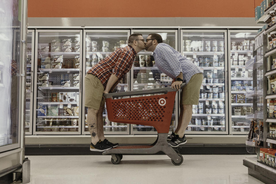 The couple made use of props in the store, including the carts. (Photo: Erica Whiting Photography)