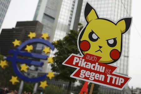 Consumer rights activists take part in a march to protest against the Transatlantic Trade and Investment Partnership (TTIP) and Comprehensive Economic and Trade Agreement (CETA) in Frankfurt, Germany, September 17, 2016. REUTERS/Kai Pfaffenbach