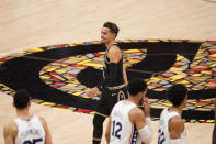 Atlanta Hawks' Trae Young, top, smiles at the end of the second half of Game 4 of a second-round NBA basketball playoff series against the Philadelphia 76ers, Monday, June 14, 2021, in Atlanta. (AP Photo/Brynn Anderson)