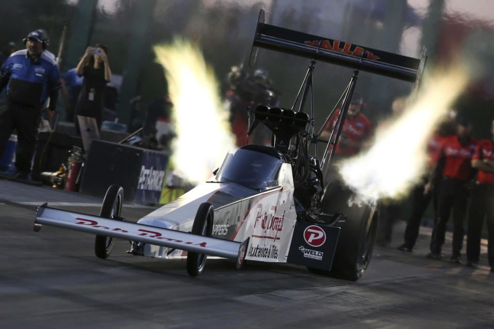 In this photo provided by the NHRA,Mike Salinas drives in Top Fuel qualifying Friday, Aug. 12, 2022, at Heartland Motorsports Park for the Menards NHRA Nationals drag races in Topeka, Kan. (Bob Szelag/NHRA via AP)