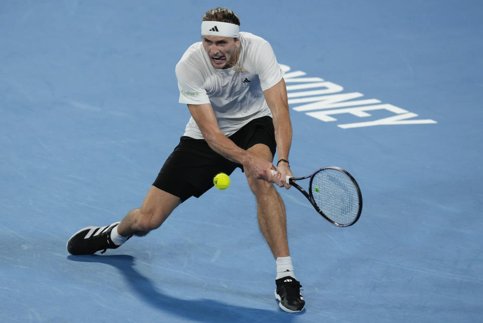 Germany's Alexander Zverev plays a backhand return to Poland's Hubert Hurkacz during the final of the United Cup in Sydney, Australia, Sunday, Jan. 7, 2024. (AP Photo/Mark Baker)