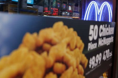 Neon McDonald's Golden Arches are seen at the Times Square location in New York in this January 29, 2015, file photo. REUTERS/Shannon Stapleton/Files