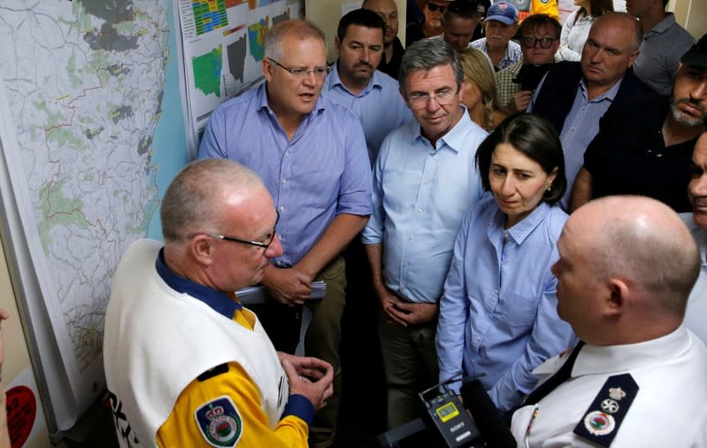 Australia's Prime Minister Scott Morrison and New South Wales Premier Gladys Berejiklian receive briefing on the fires at Mid North Coast Fire Control Centre in Wauchope