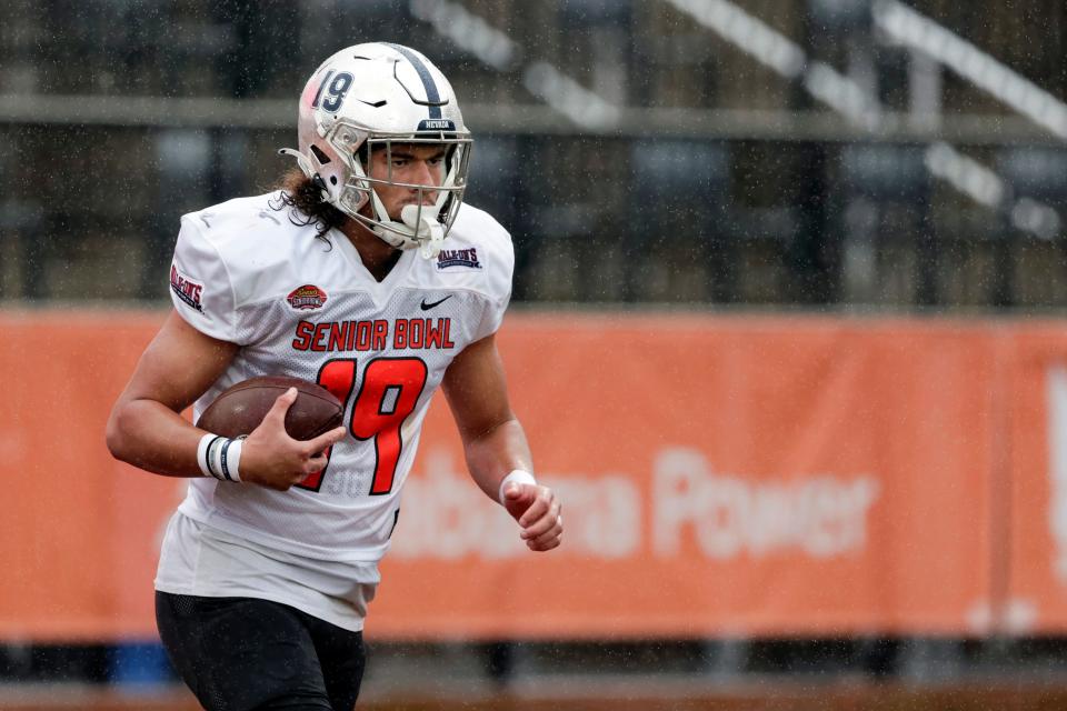 National Team tight end Cole Turner of Nevada runs through a drill during practice for the Senior Bowl football game Wednesday, Feb. 2, 2022, in Mobile, Ala. (AP Photo/Butch Dill)