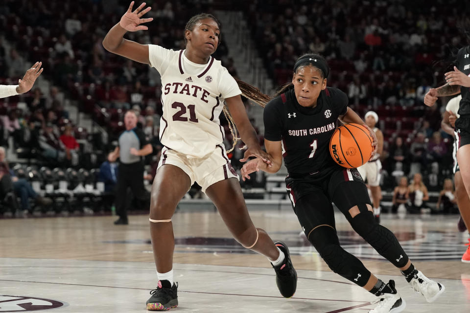South Carolina guard Zia Cooke (1) dribbles past Mississippi State guard Debreasha Powe (21) during the first half of an NCAA college basketball game in Starkville, Miss., Sunday, Jan. 8, 2023. (AP Photo/Rogelio V. Solis)