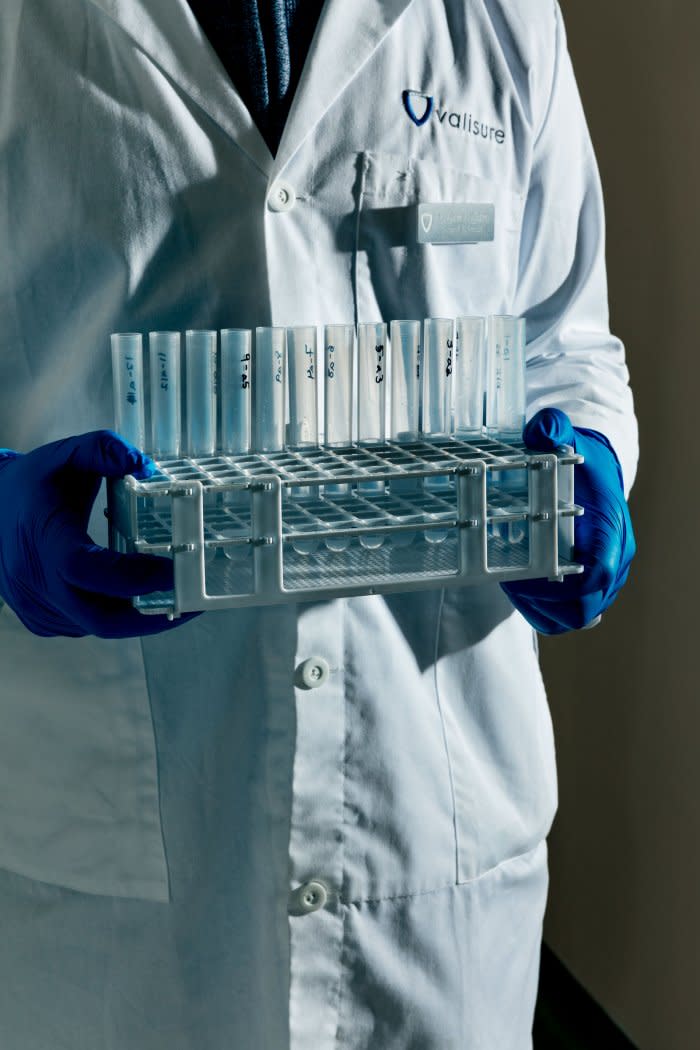 A Valisure employee carries lab samples.<span class="copyright">Adrienne Grunwald for TIME</span>