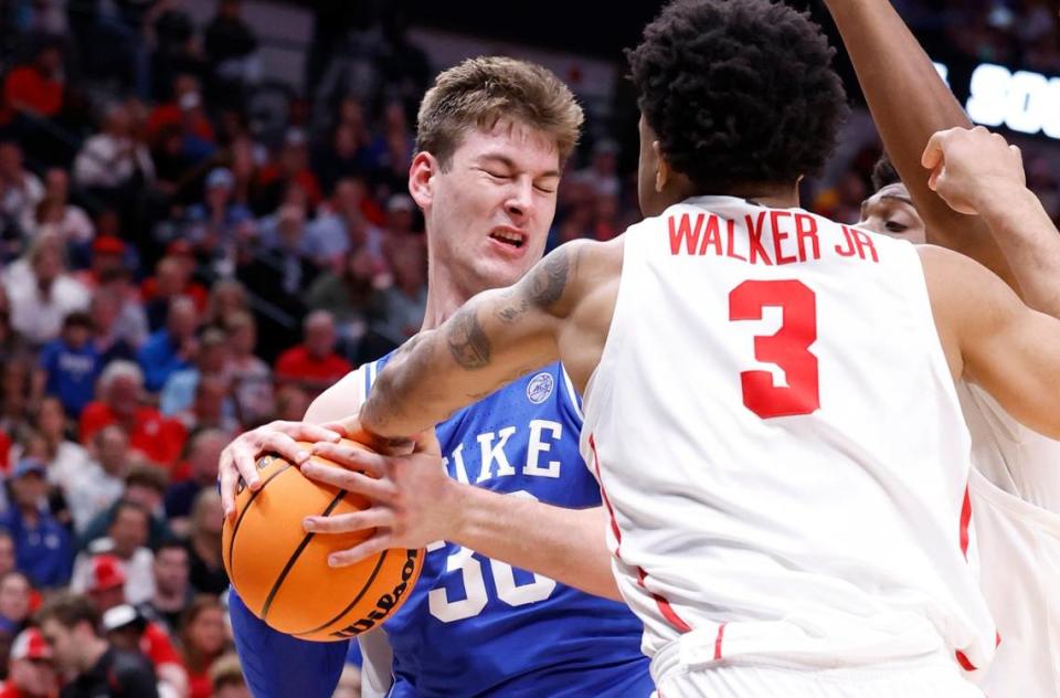 Duke’s Kyle Filipowski (30) keeps the ball from Houston’s Ramon Walker Jr. (3) during the first half of Duke’s game against Houston in their NCAA Tournament Sweet 16 game at the American Airlines Center in Dallas, Texas, Friday, March 29, 2024.