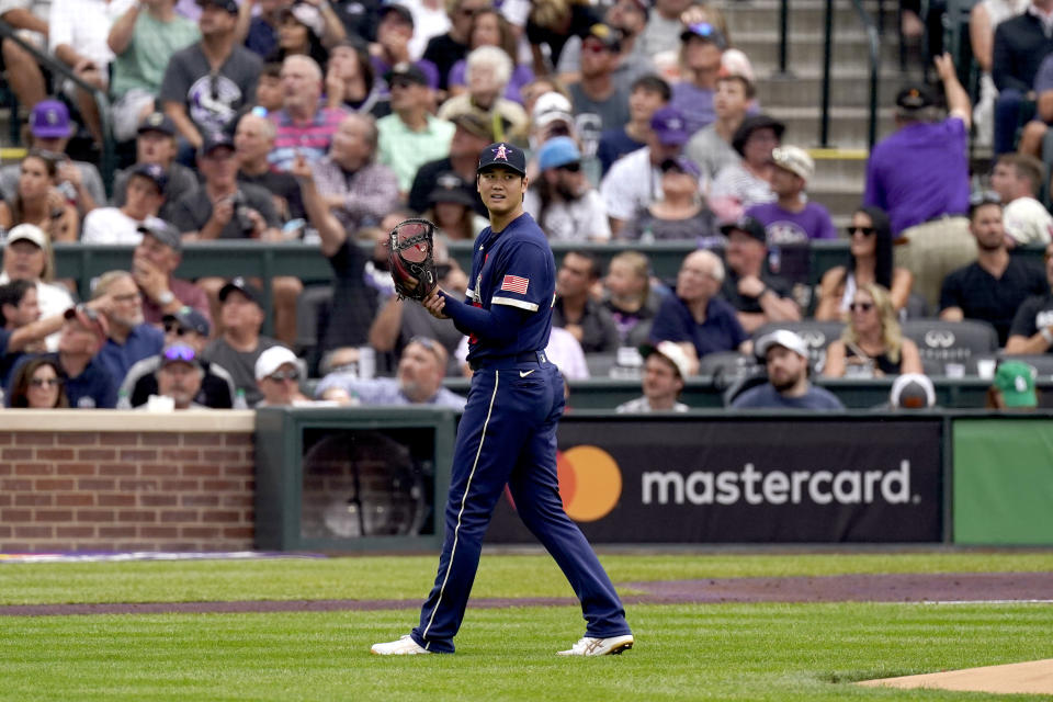 American League's starting pitcher Shohei Ohtani, of the Los Angeles Angeles, watches a fly out during the first inning of the MLB All-Star baseball game, Tuesday, July 13, 2021, in Denver. (AP Photo/Gabriel Christus)