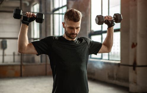 <span class="caption">Dumbbell variations allow us to adjust an exercise to better suit our body.</span> <span class="attribution"><a class="link " href="https://www.shutterstock.com/image-photo/powerful-brutal-adult-bearded-male-sportswear-2057035379" rel="nofollow noopener" target="_blank" data-ylk="slk:Max kegfire/ Shutterstock;elm:context_link;itc:0;sec:content-canvas">Max kegfire/ Shutterstock</a></span>