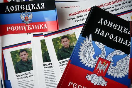 Election information sheets are pictured on display during preparations for the upcoming election, with portraits of Alexander Zakharchenko, separatist leader of the self-proclaimed Donetsk People's Republic, seen on leaflets, at a polling station in Donetsk, eastern Ukraine, October 31, 2014. REUTERS/Maxim Zmeyev