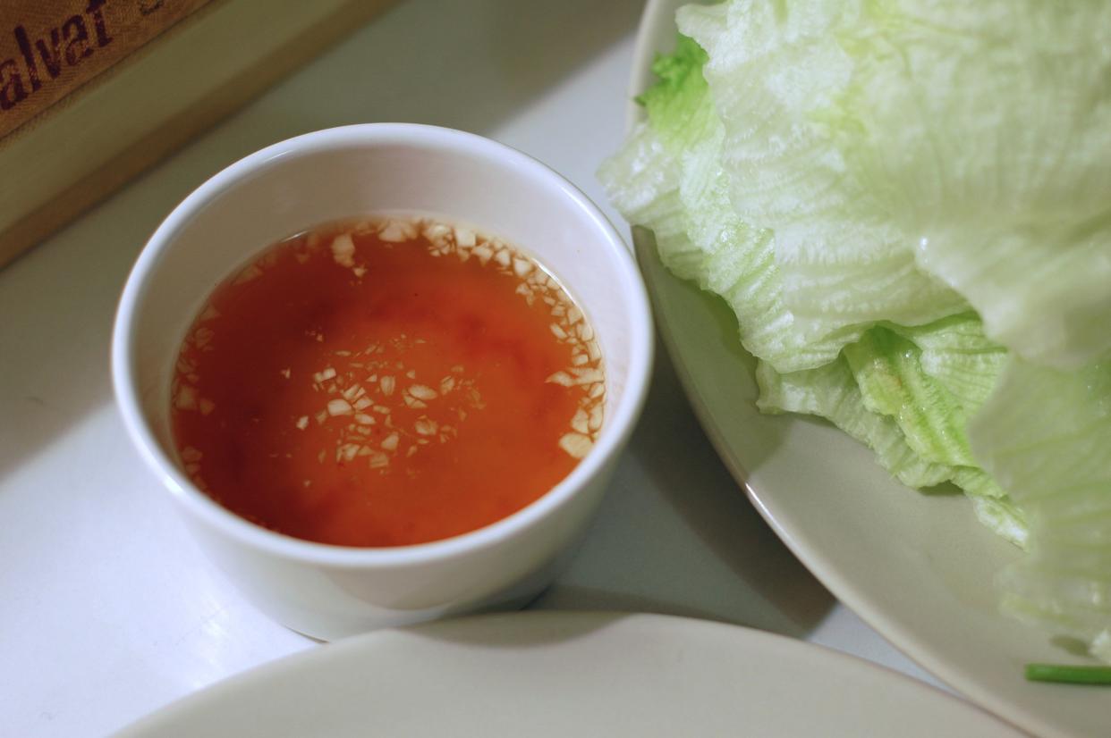 a small bowl of nuoc cham, vietnamese dipping sauce