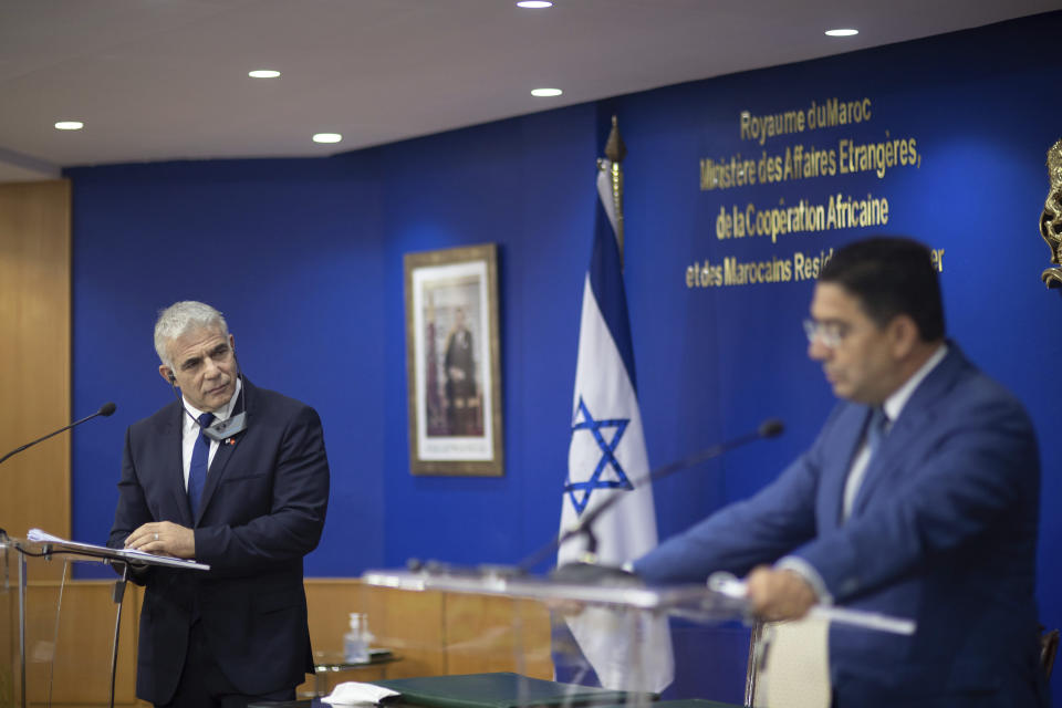 Moroccan Foreign Minister Nasser Bourita, right, and Israeli Foreign Minister Yair Lapid, hold a press conference after signing cooperation agreements between the two countries, in Rabat, Morocco, Wednesday, Aug. 11, 2021. The Israeli Foreign Minister Yair Lapid is on an official visit to Morocco. (AP Photo/Mosa'ab Elshamy)