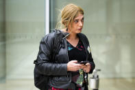 Tessa Ganserer a new lawmaker of the Green party walks through the German parliament Bundestag building, the Reichstag Building, in Berlin, Tuesday, Sept. 28, 2021. Sunday's national election making Germany's lower house of parliament, or Bundestag, more diverse and inclusive than ever before. For the first time there are also two transgender women, at least three people of African descent and, after years of stagnation, the number of female lawmakers has gone up again as well. (AP Photo/Markus Schreiber)