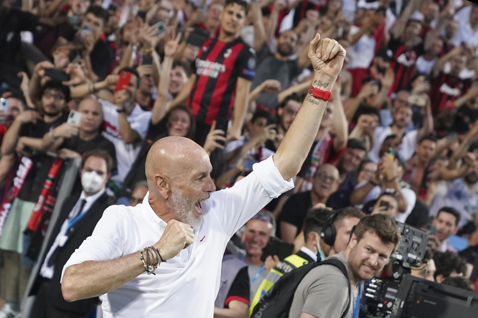 AC Milan coach Stefano Pioli celebrates after winning a Serie A soccer match between AC Milan and Sassuolo, in Reggio Emilia's Mapei Stadium, Italy, Sunday, May 22, 2022. AC Milan secured its first Serie A title in 11 years on Sunday with a 3-0 win at Sassuolo. (Spada/LaPresse via AP)