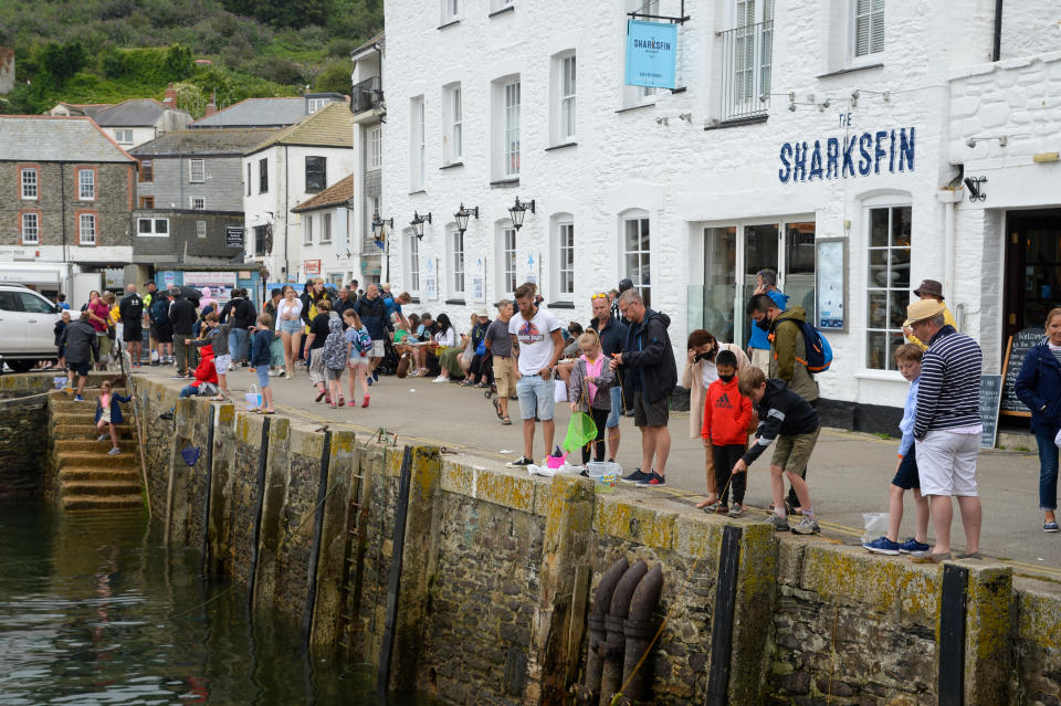 MEVAGISSEY, ENGLAND - JULY 29: Tourists are seen on July 29, 2021 in Mevagissey, United Kingdom. (Photo by Finnbarr Webster/Getty Images)